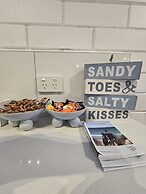 Sandy Toes and Salty Kisses