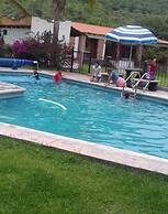 Los Pocitos Cabañas y Hotel