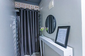 The Den Soroti White