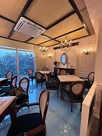 GREEN GARDEN CAFE & HOTEL