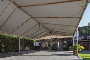 Capital O La Huerta Golf & Hotel