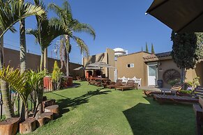 Capital O La Huerta Golf & Hotel