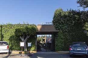 Capital O La Huerta Golf & Hotel