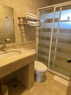 Capital O La Huerta Golf & Hotel