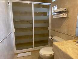 Capital O La Huerta Golf & Hotel