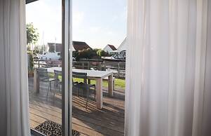 Nice Holiday Home on the Water in Grou