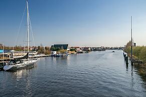 Nice Holiday Home on the Water in Grou