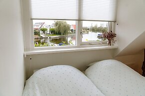 Nice Holiday Home on the Water in Grou