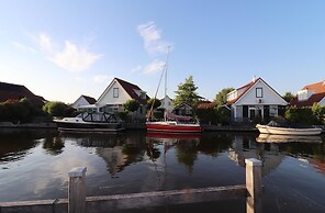 Nice Holiday Home on the Water in Grou