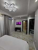 SUNA'A HOME LOGPOM