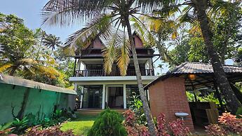 Mango Lantern Villa By Mirth Kollam