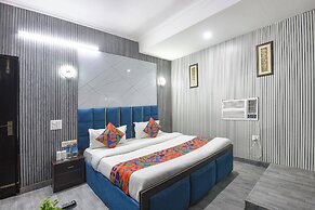 Fabhotel Happy Residency