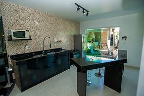 Casa com Piscina Quadra de Areia e Churrasqueira
