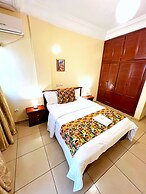 Appart'hôtel Micheline Suites Bastos