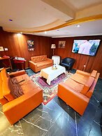 Appart'hôtel Micheline Suites Bastos