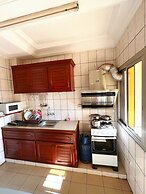 Appart'hôtel Micheline Suites Bastos