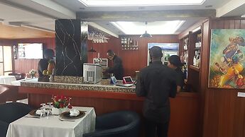 Appart'hôtel Micheline Suites Bastos