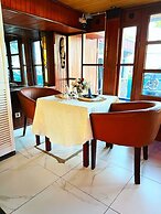 Appart'hôtel Micheline Suites Bastos