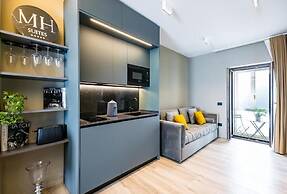 MH SUITES PLEBISCITO