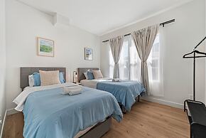 Spacious 8BR Home with AC & Parking