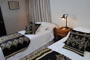 Rio Arriba Suites Apartments y Resto