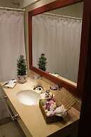 Rio Arriba Suites Apartments y Resto