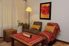 Rio Arriba Suites Apartments y Resto