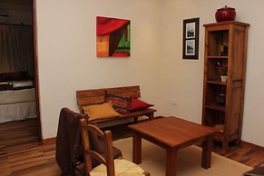 Rio Arriba Suites Apartments y Resto