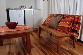 Rio Arriba Suites Apartments y Resto