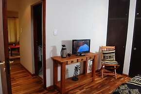 Rio Arriba Suites Apartments y Resto