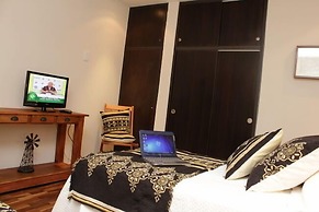 Rio Arriba Suites Apartments y Resto