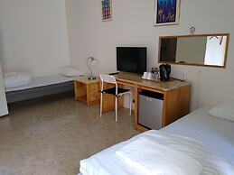 Milano Garden - City Bungalow Hotell, i gränssnittet till Kullabygdens