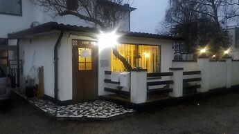 Milano Garden - City Bungalow Hotell, i gränssnittet till Kullabygdens