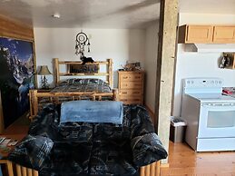 Wolf Den Log Cabin Motel and RV Park