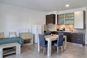 Helios Studios & Apts