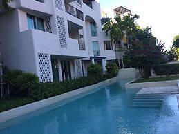 The Che Pool Access Beachfront Condo by Away