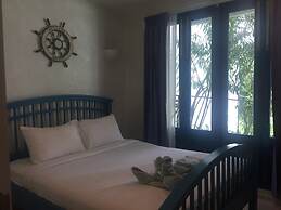 The Che Pool Access Beachfront Condo by Away