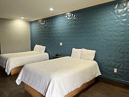 Symphony Inn and Suites