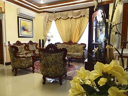 The Executive Villa Inn & Suites