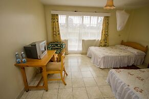 Harlequin Suites Hotel