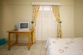 Harlequin Suites Hotel