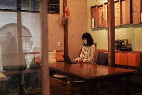 Taketa station hostel cue