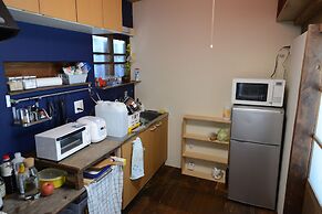 Taketa station hostel cue