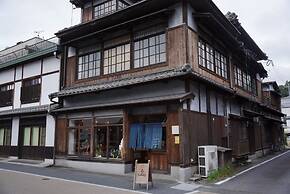 Taketa station hostel cue