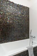 Family Apt & Private Garden near Beach by FeelHome