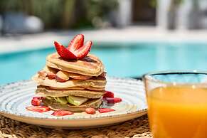 Adorno Beach Hotel & Suites