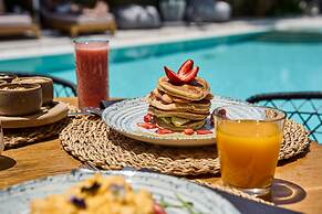 Adorno Beach Hotel & Suites