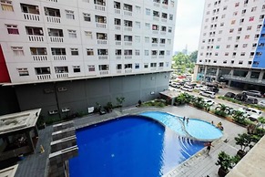 2 Bedrooms at Green Pramuka City Apartment By Travelio