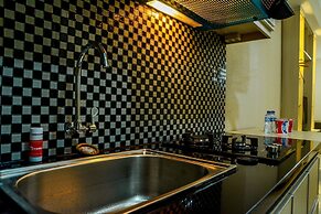 Modern Studio Grand Serpong Apartment By Travelio