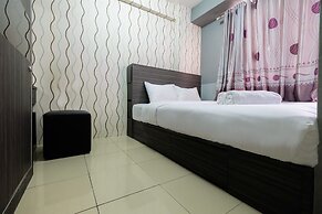 Monochrome Style 2 Bedrooms at Kalibata City Apartment By Travelio